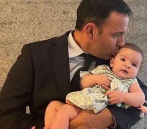 Javier Calleja with his granddaughter Daniela during her Christening.